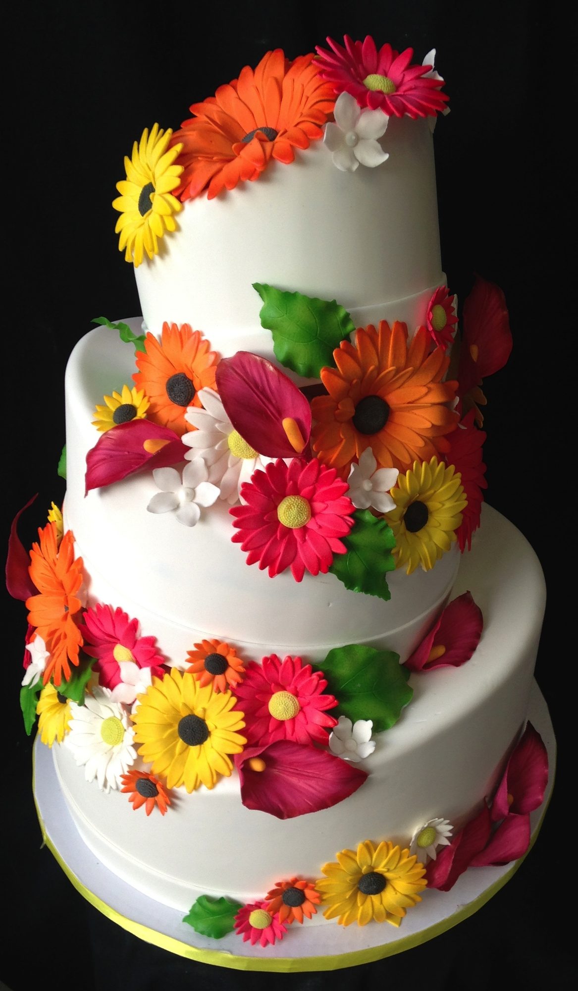 Wedding cake with bright sugar gerbera daisies